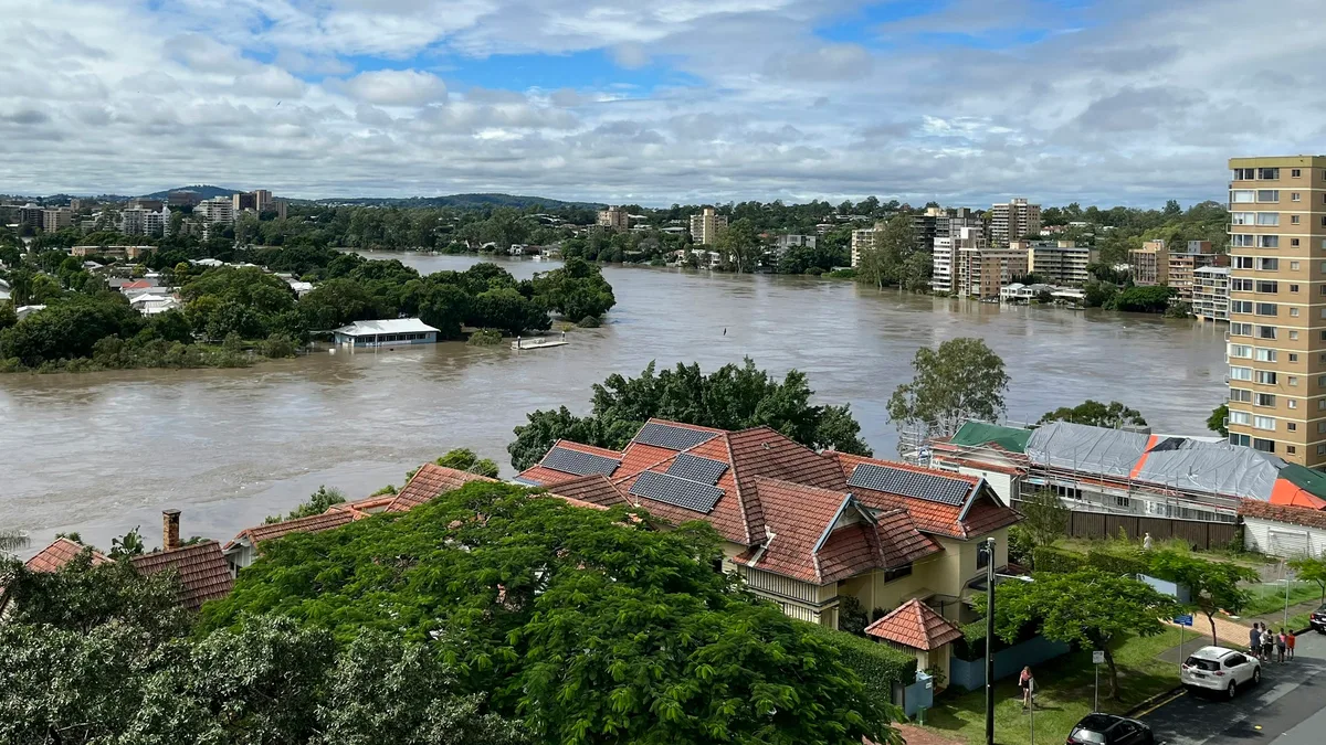 Flood watches issued across Queensland and NSW as unseasonal storms dump heavy rain