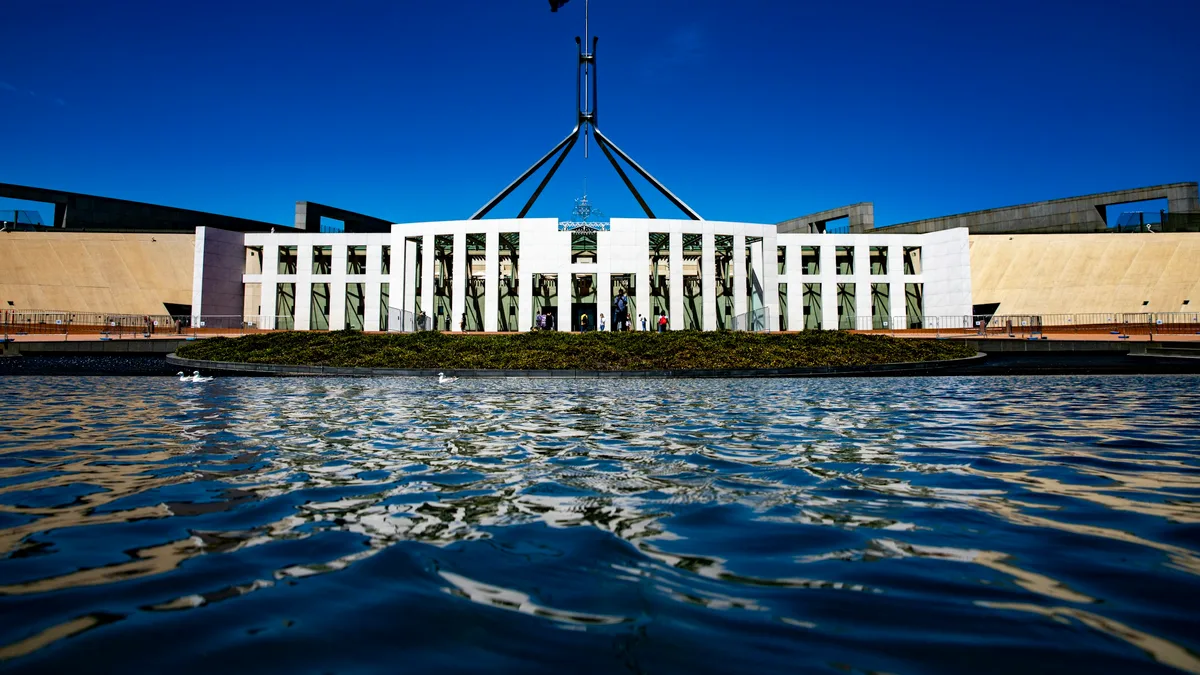 Greens back Labor budget after winning NDIS inquiry extension, critics warn of 300,000 losing support